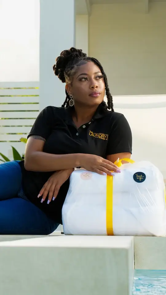 Professional laundry service with clean, organized washing machines and folding area