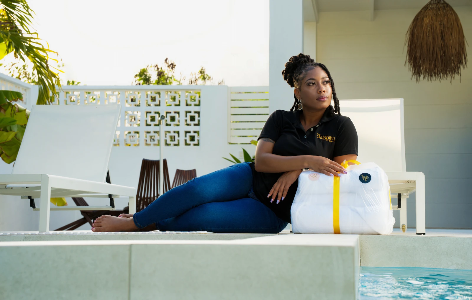 Professional laundry service with clean, organized washing machines and folding area